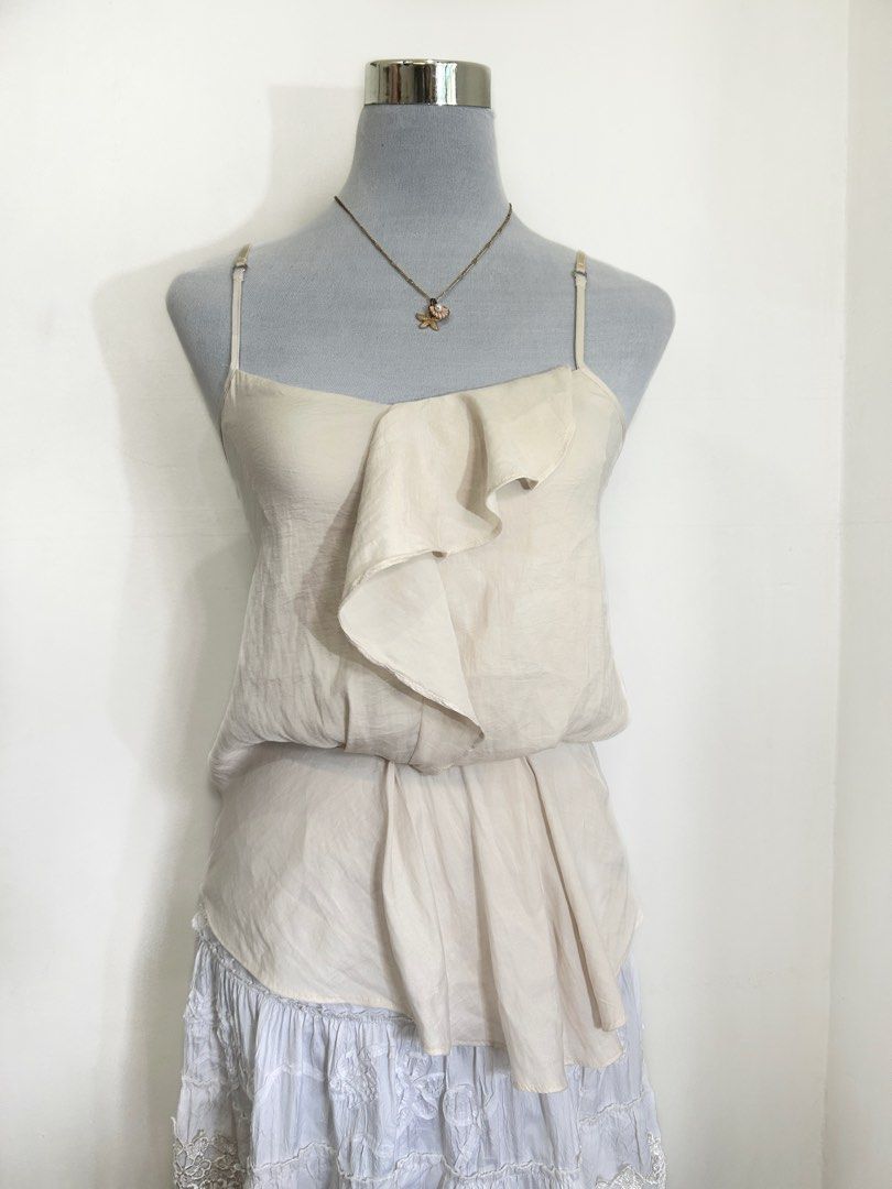 OBAKKI Cream Elegant asymmetrical fluid cascading ruffle down Cami (Category: Sleeveless) located in Quezon City. Submitted by cooroe.mnl (Listing ID 1466521107, Image 2). Description: S-M 10/10 .