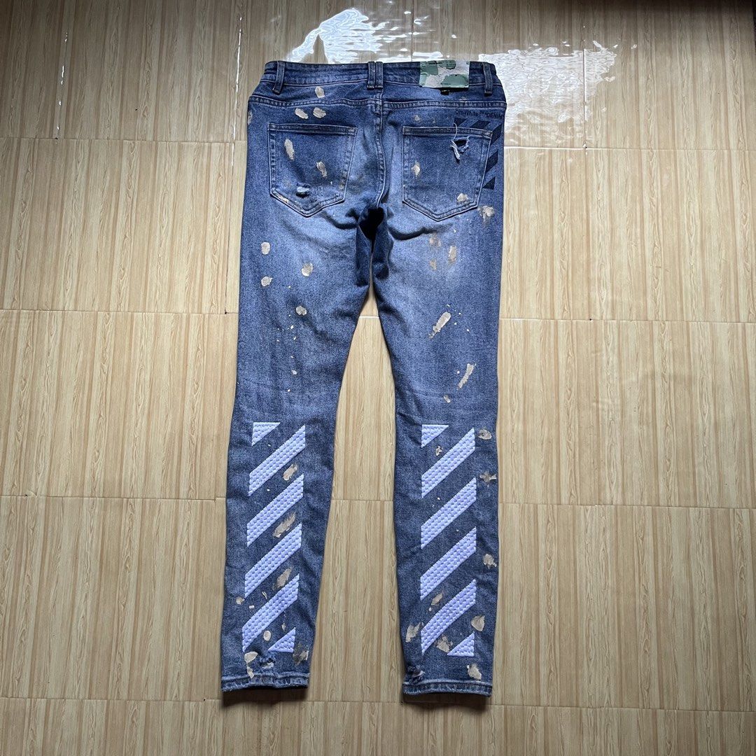 Off-White c/o Virgil Abloh distressed (Category: Jeans) located in Hagonoy. Submitted by ianthrift_ph (Listing ID 1466525296, Image 1). Description: complete tags/authentic 30 to 32 waistline 40 length, 11 thigh, 6.5 hem slim fit, all over splatter paint good condition color rate 9/10 minor flaws .