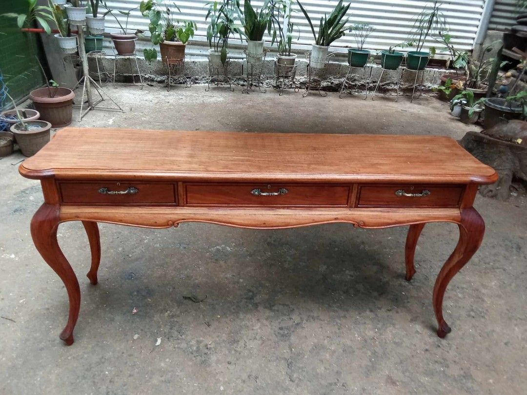 Old Console Table (Category: Other Home Furniture) located in Rizal. Submitted by mommykiee (Listing ID 1466384804, Image 1). Description: Old Console Table Made of narra wood 1pc top Size: L67 W17 H32inch Stripped & varnished.