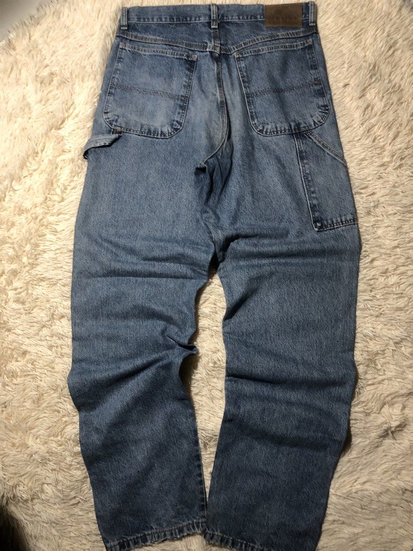 Old Mill Vintage Carpenter Pants (Category: Jeans) located in Maria Aurora. Submitted by kylerikathriftshop101010 (Listing ID 1466509426, Image 1). Description: 33 waist 45 length 8.2 hem - Brand: Old Mill - Style: Classic blue denim carpenter jeans / Workwear - Wash: Medium wash with subtle fading - Features: Utility tool pockets, side hammer loop, and branded leather back patch - Closure: Heavy-duty metal button - Condition: Durable stitching t