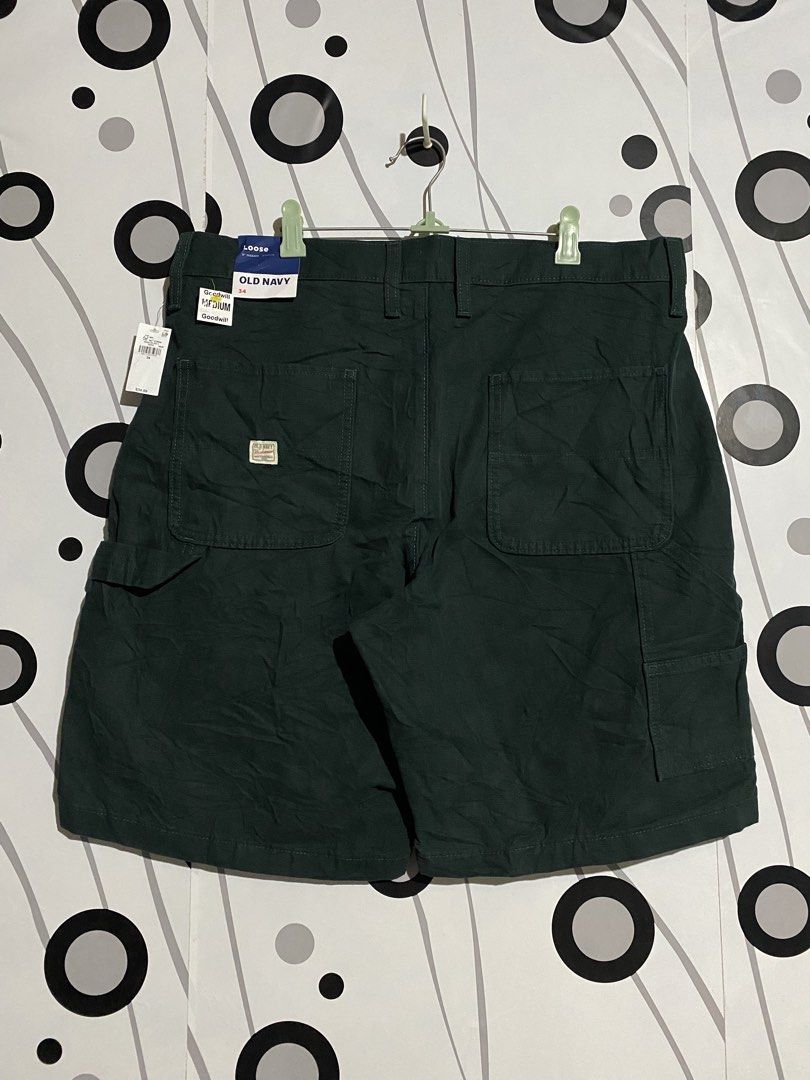 Old Navy Workwear carpenter shorts (Category: Shorts) located in Cebu City. Submitted by patspickph (Listing ID 1466399477, Image 1). Description: This is a dark green Old Navy Workwear loose carpenter shorts. Waistline 34-36 inches, Length 20 inches and Leghole is 12 inches. Brand New with tags No issue Excellent Condition👍👌.