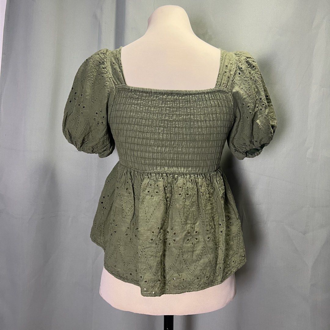 olive green eyelet puff sleeve top (Category: Blouses) located in Malabon City. Submitted by minidressmonster (Listing ID 1466487423, Image 3). Description: olive green puff sleeve square neck top ruched back and garterized sa arm holes good as new, barely used small to med.