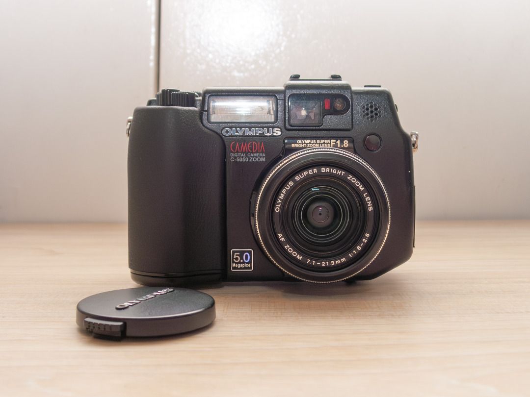 Olympus Camedia C-5050 Zoom Digicam (Category: Cameras) located in Quezon City. Submitted by melomonserrat (Listing ID 1466476157, Image 1). Description: - 5 Megapixel CCD Sensor - 35-105mm (full frame equivalent), f1.8 - f2.6 lens - Magnesium alloy body - tiltable screen - can use CF Cards, SmartMedia cards, and XD cards all at the same time - 800+ photos on HQ image setting, 270+ on SHQ (130+ on RAW) with a 1GB CF Card - built-in flash works, h