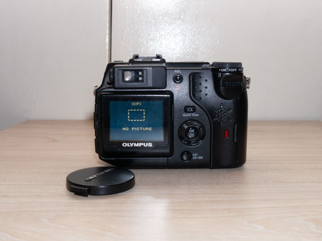 Olympus Camedia C-5050 Zoom Digicam (Category: Cameras) located in Quezon City. Submitted by melomonserrat (Listing ID 1466476157, Image 2). Description: - 5 Megapixel CCD Sensor - 35-105mm (full frame equivalent), f1.8 - f2.6 lens - Magnesium alloy body - tiltable screen - can use CF Cards, SmartMedia cards, and XD cards all at the same time - 800+ photos on HQ image setting, 270+ on SHQ (130+ on RAW) with a 1GB CF Card - built-in flash works, h