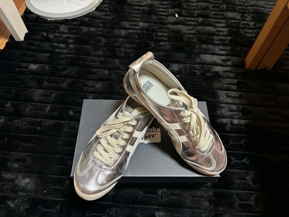 Onitsuka Tiger Metallic Silver Shoes with Box (Category: Sneakers) located in Bulacan. Submitted by trippin_thriftin (Listing ID 1466467882, Image 1). Description: Size 42.5 Complete With Box (Bought from Japan) No ISSUE - Brand: Onitsuka Tiger - Color: Metallic silver with cream laces and classic side stripes - Style: Low-profile, comfortable everyday wear - Condition: Clean uppers, very little wear on the soles - Inclusion: Comes with the origi