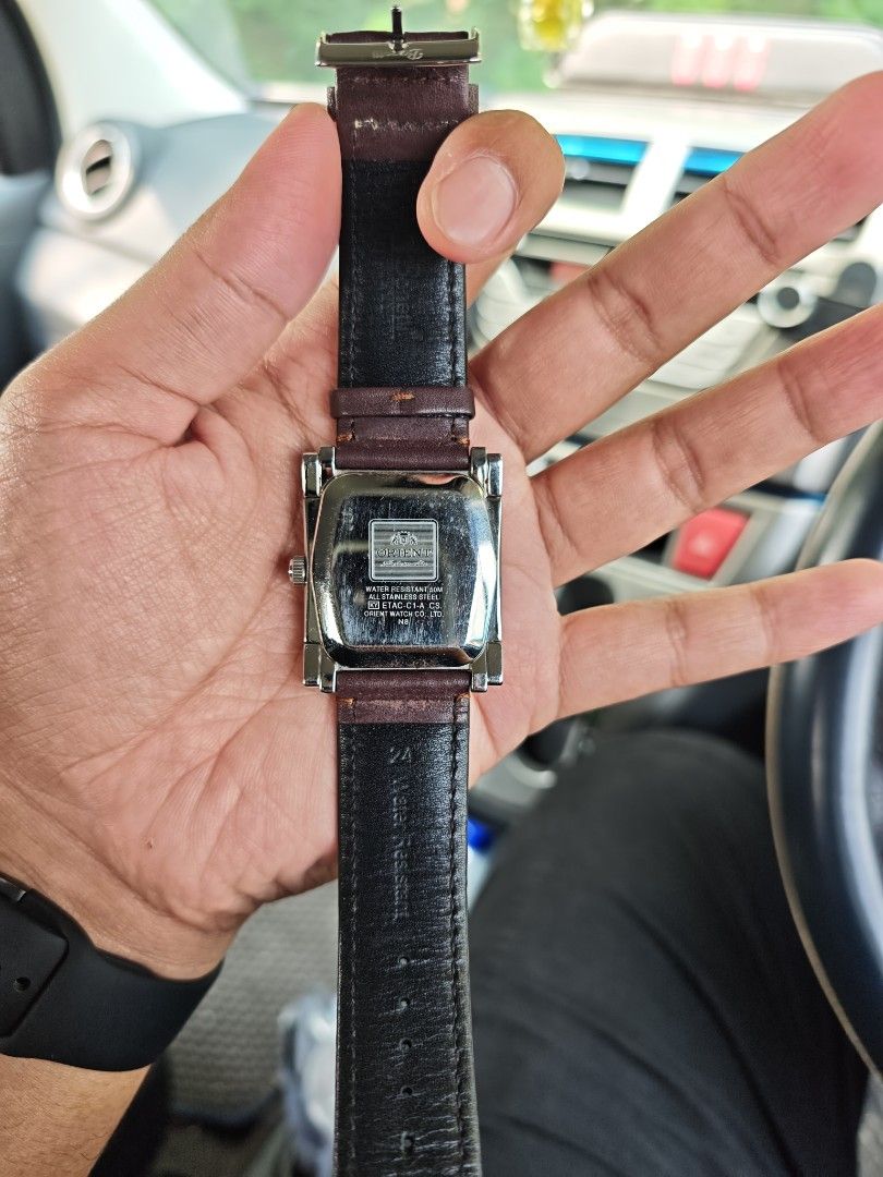Orient Automatic Rectangular Dial Men's Watch (Category: Watches) located in Kuala Terengganu. Submitted by adibrahman65183 (Listing ID 1466539760, Image 2). Description: Authentic Orient automatic watch with a striking rectangular silver dial, large Arabic numerals, and a dark brown leather strap. Features day, date, and 24-hour sub-dials with 50m water resistance. Note: date needs repair, to be sell as collection.