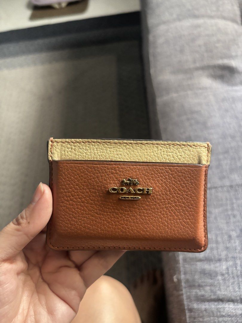 Original coach card holder (Category: Wallets & Card holders) located in Manila. Submitted by usedbutnotabuse (Listing ID 1466348348, Image 2). Description: Original bought in coach store See photos, but not affecting the outside look.