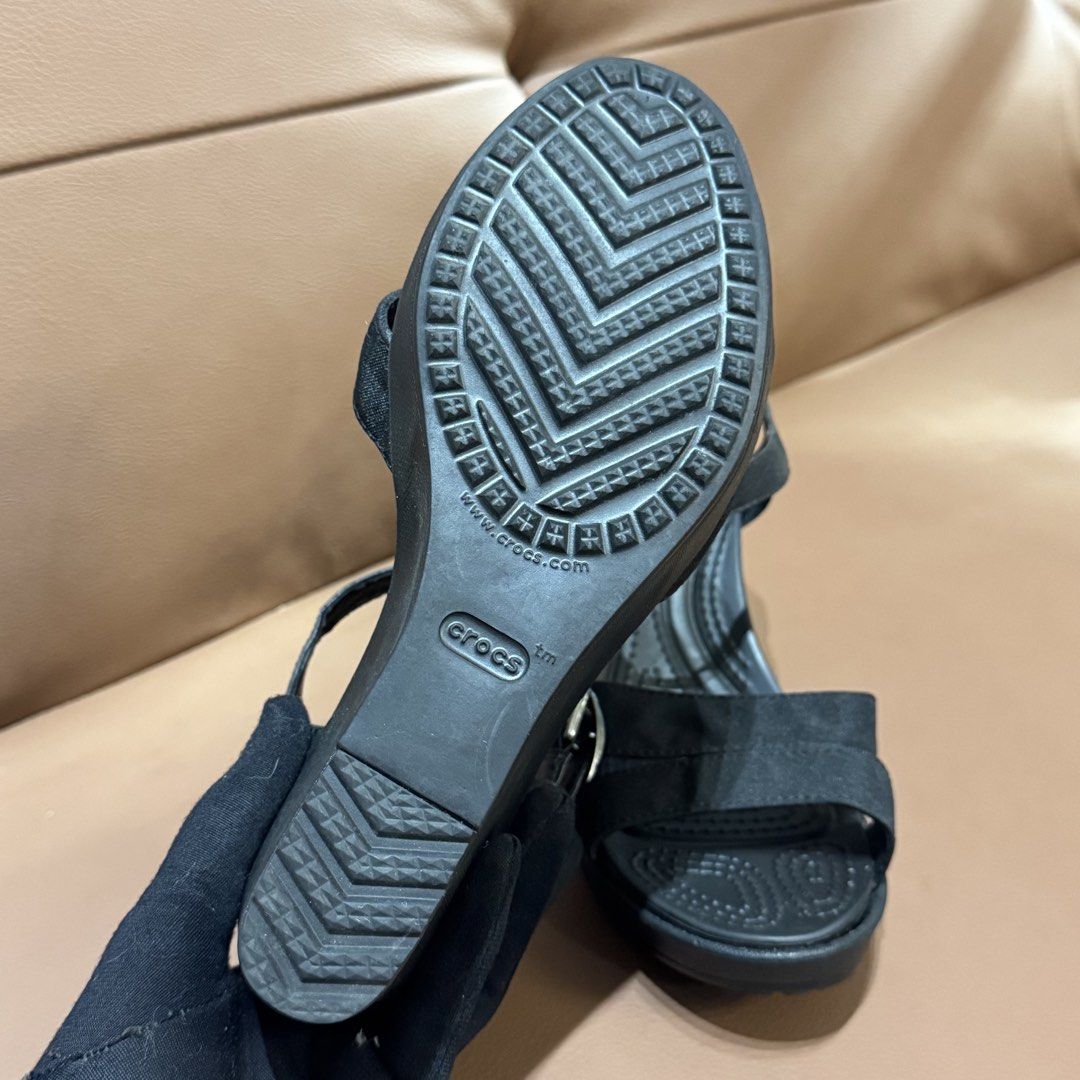 Original Crocs Black Wedge Sandals (Category: Wedges) located in Rizal. Submitted by houseofbell (Listing ID 1466504333, Image 3). Description: - Brand/Model: Crocs Wedge Sandals - Size: Women's W7 - Color: Black - Design: genuine leather strap with adjustable buckle ankle strap - Comfort: Dual Crocs comfort footbed for extra cushioning and support - Condition: Clean soles with great tread grip - Origin: Made in Vietnam -size 7.