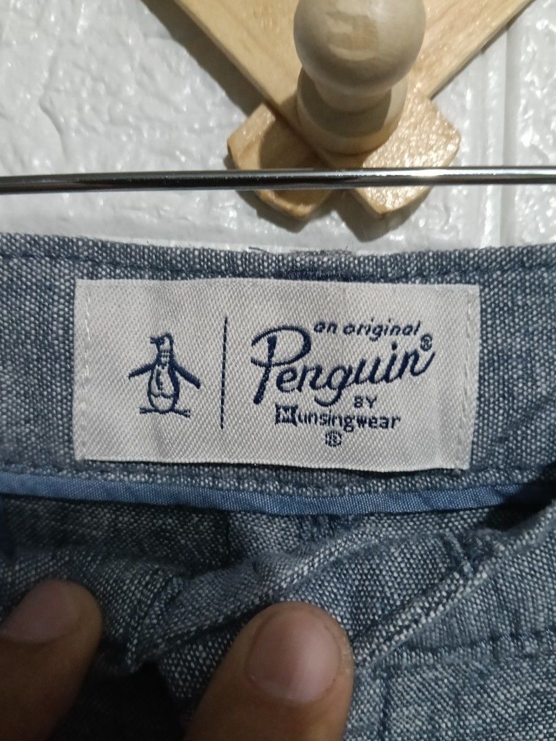 Original Penguin Blue Shorts Size 33 (Category: Shorts) located in Manila. Submitted by marvinenri31598 (Listing ID 1466353823, Image 3). Description: - Brand: Original Penguin - Color: Blue - Size: US 33 / EU 49 - Material: Lightweight cotton - Origin: Made in Vietnam - Features: Button closure, zip fly, front pockets, rear welt pockets, and embroidered penguin logo - Style: Comfortable casual wear for warm weather.