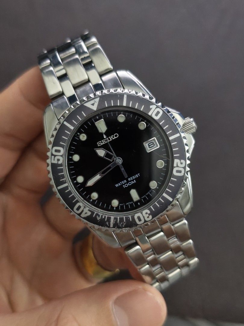 Original Seiko Divers 100m Black Dial Quartz Mens (Category: Men's Watches) located in Tarlac. Submitted by irishign0593824 (Listing ID 1466477839, Image 1). Description: watch only. size 6.6ich wrist max size. no extra links selling it as is..