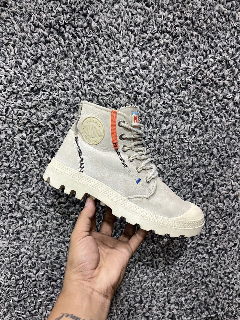 Palladium Pampa Underlayer High Top Trainers | Size 38 (Category: Boots) located in General Trias. Submitted by zrchustle.604 (Listing ID 1466443545, Image 1). Description: Palladium Pampa Underlayer High Top Trainers, featuring a distinct sand/beige colorway accented by bright orange detailing down the collar, exposed decorative stitching, and a side zipper closure. The Pampa Underlayer model updates Palladium's traditional canvas utility boot p
