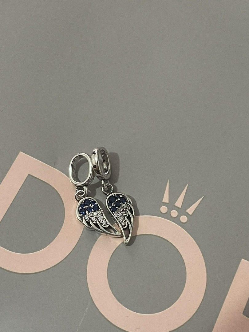 Pandora Splittable angel wings dangle charm (Category: Charms) located in Manila. Submitted by mycloset2025 (Listing ID 1466352671, Image 2). Description: .