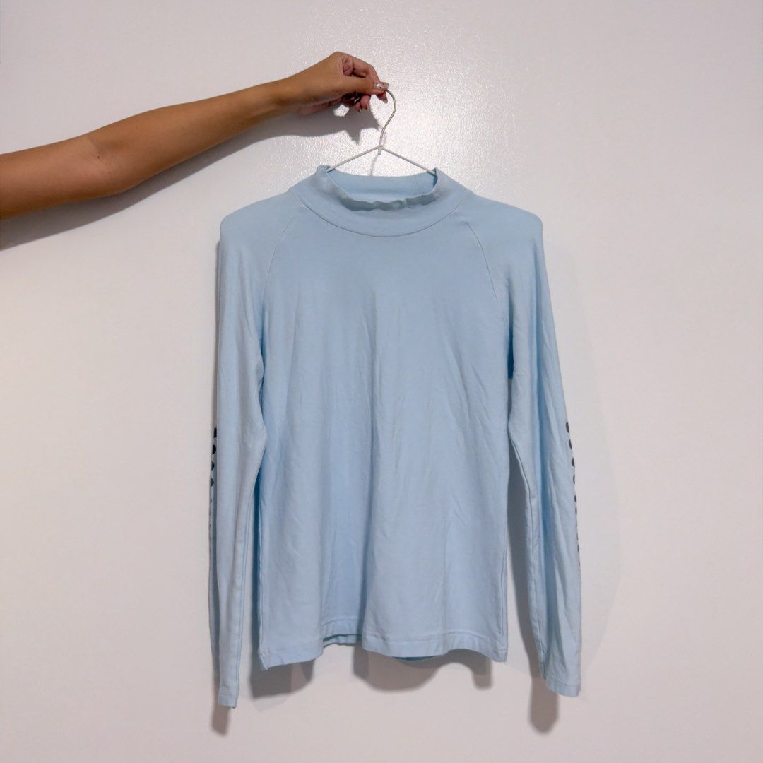 pastel blue turtle neck top (Category: Longsleeves) located in Cebu City. Submitted by cuteoncue (Listing ID 1466535897, Image 2). Description: small-med large on tag but runs small. last photo shows the detail on the sides of both sleeves..