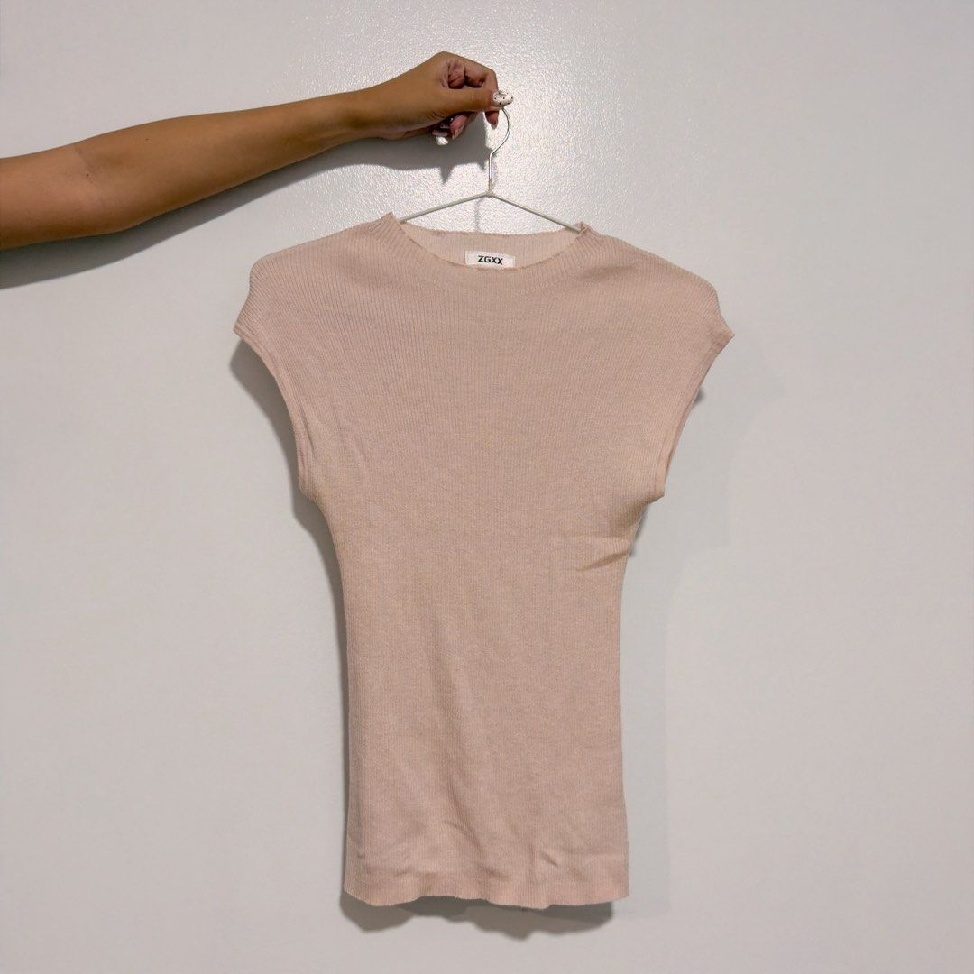 pastel pink knitted top (Category: Blouses) located in Cebu City. Submitted by cuteoncue (Listing ID 1466395285, Image 2). Description: xs-small please see last photo for barely visible washable stain. the item was freshly laundered but not soaked or stain-treated..