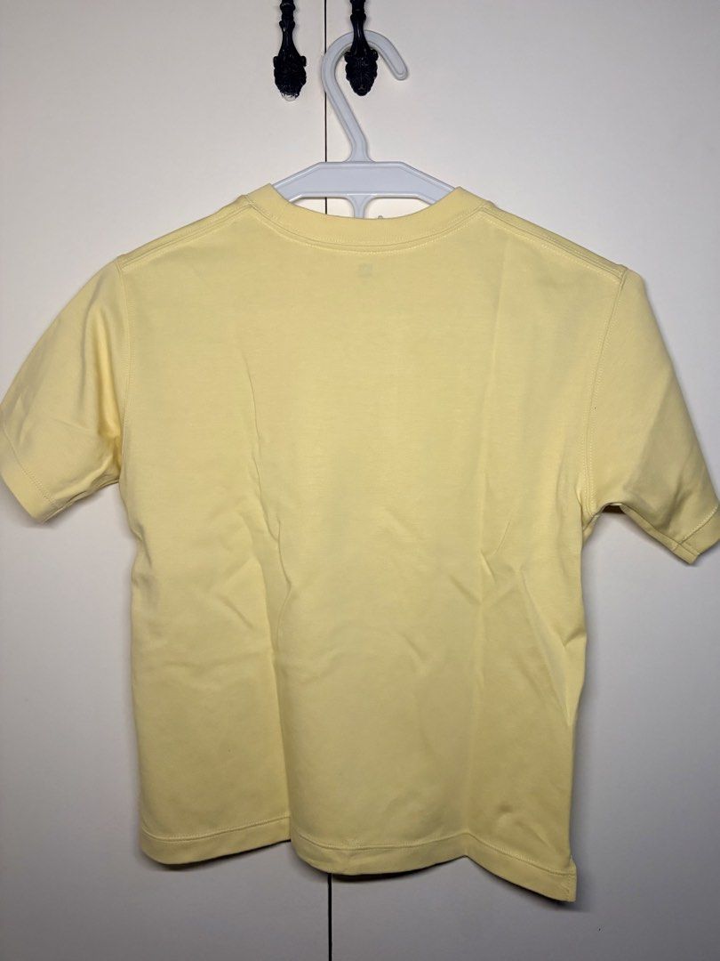 Pastel Yellow Crew Neck Tee (Category: Shirts) located in Paranaque City. Submitted by honeykkkk (Listing ID 1466489729, Image 2). Description: • Details: Classic round neck short-sleeve shirt in soft pastel yellow with thick collar ribbing and small side hem slits. • Condition: Worn once only (Like new condition). • Original Retail Price: PHP 290 – PHP 490 • Size: Tagged 130 (Fits XXS to S / Kids 7-8Y)..