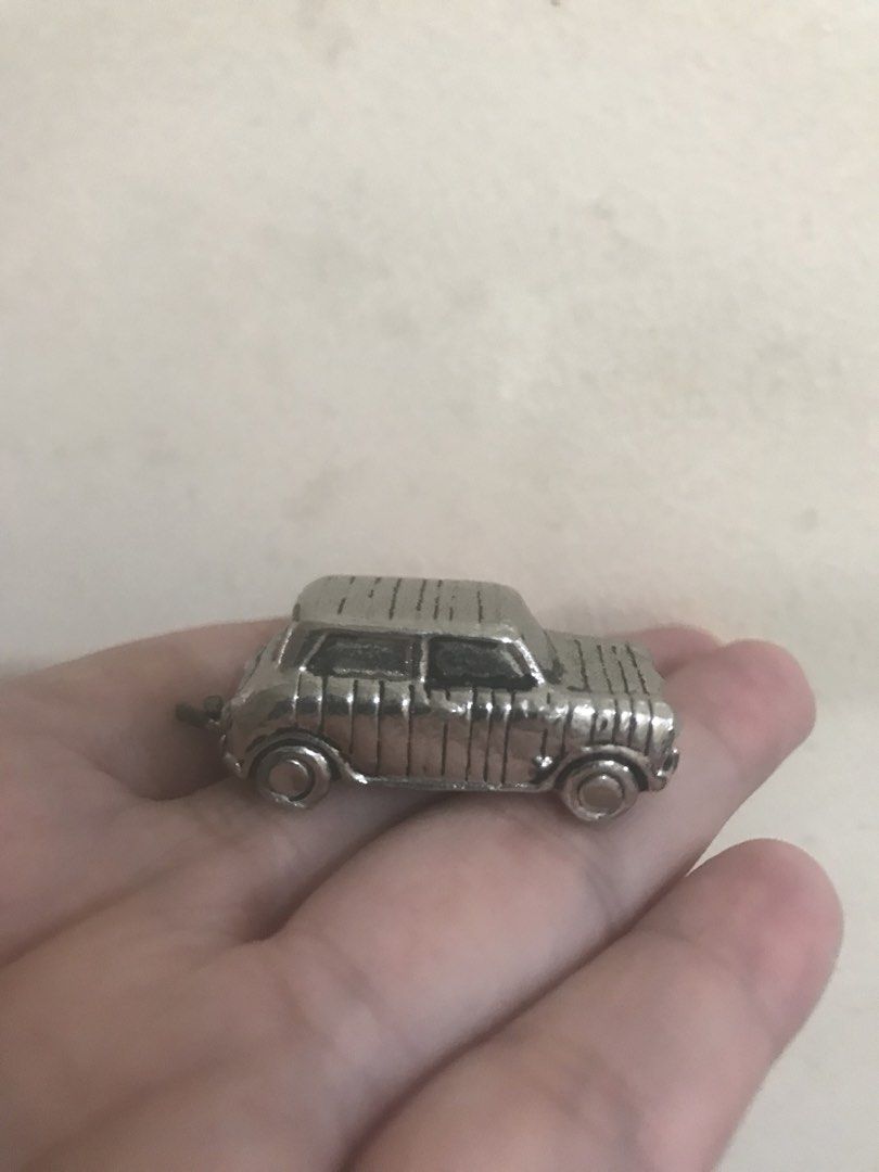 Paul Smith Mini Cooper Car Keychain Charm (Category: Vehicle & Diecast Models) located in Caloocan City. Submitted by prelovebyoreo (Listing ID 1466343446, Image 3). Description: - Brand: Paul Smith - Design: Classic Mini Cooper Woody with wood-panel texture engraving - Details: Includes small keyring attachment at the rear and engraved signature logo on the bottom plate - Feel: Solid metal weight that fits comfortably in the palm of your hand - 