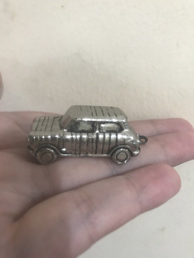 Paul Smith Mini Cooper Car Keychain Charm (Category: Vehicle & Diecast Models) located in Caloocan City. Submitted by prelovebyoreo (Listing ID 1466343446, Image 1). Description: - Brand: Paul Smith - Design: Classic Mini Cooper Woody with wood-panel texture engraving - Details: Includes small keyring attachment at the rear and engraved signature logo on the bottom plate - Feel: Solid metal weight that fits comfortably in the palm of your hand - 