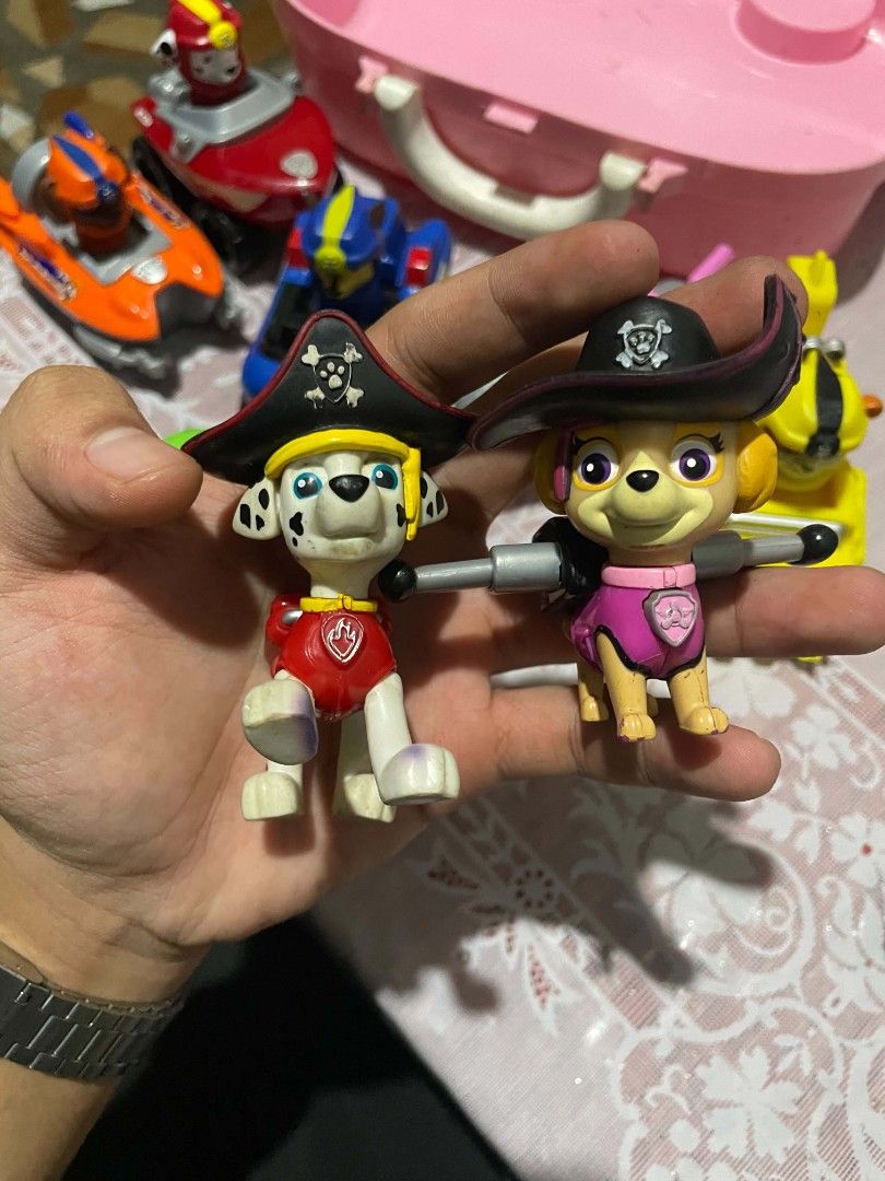 Paw Patrol Action Figures with Vehicles Set (Category: Action & Battle Toys) located in Manila. Submitted by mikeee03 (Listing ID 1466383190, Image 3). Description: - Complete set of 6 Paw Patrol figures and rescue vehicles: Chase, Marshall, Rubble, Rocky, Zuma, and Skye - Includes bonus interchangeable pirate hats for Marshall and Skye - Clean and well-maintained condition - Sold as a complete set only - Perfect gift for young Paw Patrol fans.