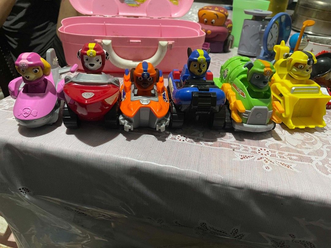 Paw Patrol Action Figures with Vehicles Set (Category: Action & Battle Toys) located in Manila. Submitted by mikeee03 (Listing ID 1466383190, Image 2). Description: - Complete set of 6 Paw Patrol figures and rescue vehicles: Chase, Marshall, Rubble, Rocky, Zuma, and Skye - Includes bonus interchangeable pirate hats for Marshall and Skye - Clean and well-maintained condition - Sold as a complete set only - Perfect gift for young Paw Patrol fans.