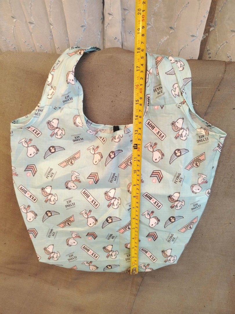 Peanuts Snoopy Flying Ace Foldable Reusable Tote Bag (Category: Tote Bags) located in San Fernando. Submitted by jpmarketplace2023 (Listing ID 1466431360, Image 2). Description: 💚 All items are authentic from Japan. 💛 MOP: GCash (❌️ GCash Protect) 🩵 MOD: LBC only (❌️ S. Checkout, COD, COP) 💙 Meet-up: Vista Mall, San Fernando, Pampanga 💜 All items are on-hand. 🧡 First to pay gets the item first. ❤️ Breakable items are packed with care and ca