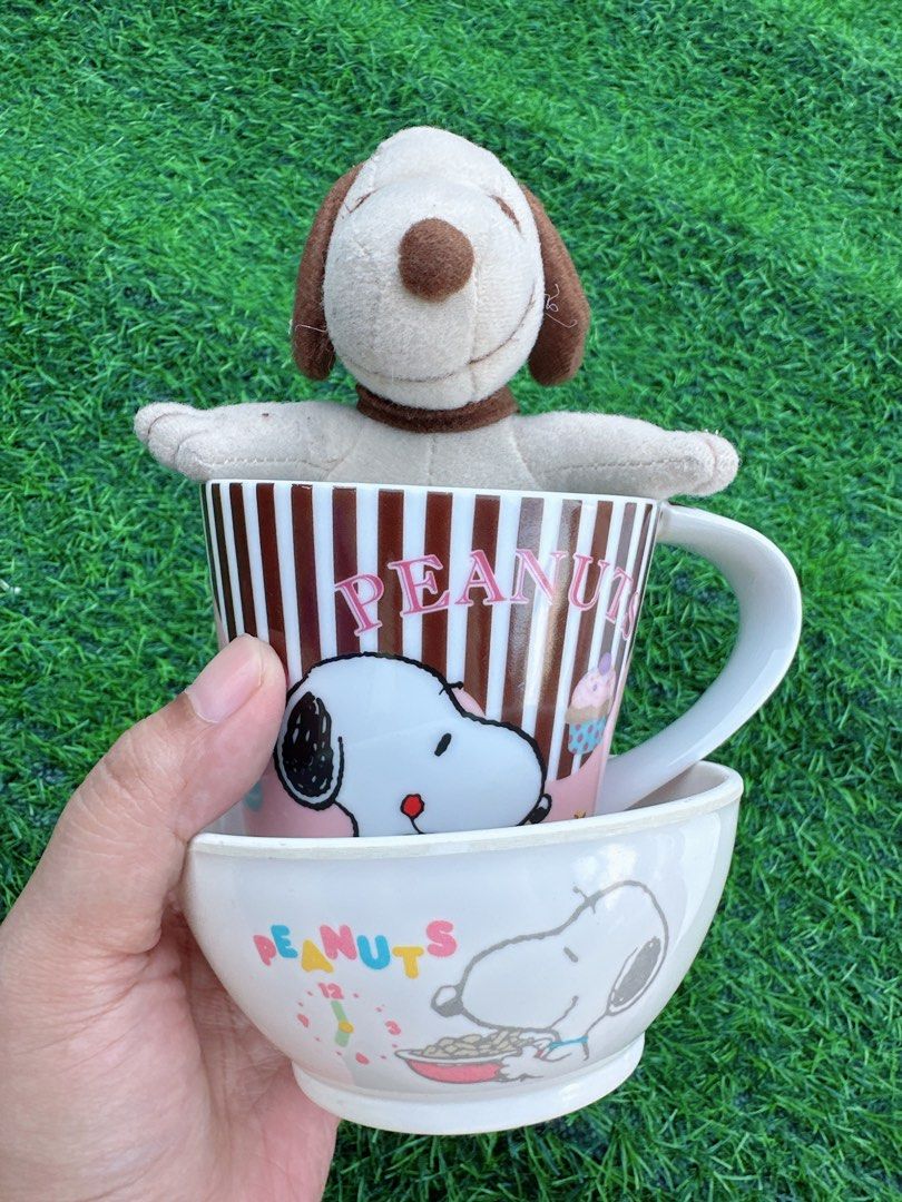 Peanuts Snoopy Mug Bowl and Plush Keychain Set (Category: Character Goods) located in Manila. Submitted by ronoarabbit.ph (Listing ID 1466435125, Image 2). Description: Peanuts Snoopy bundle including a ceramic mug with brown stripes, matching bowl with Snoopy eating cereal graphic, and a small plush toy keychain with tag. Official merchandise from United Feature Syndicate. Pink and white color scheme with sweet dessert graphics. Great collector 