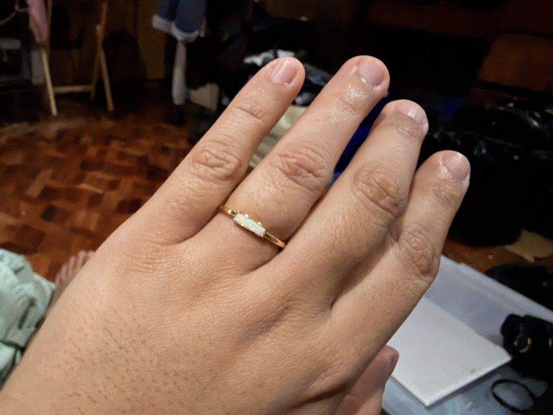 Penny Pairs Opal Ring (Size 9) (Category: Rings) located in Marikina City. Submitted by nj1989 (Listing ID 1466470292, Image 2). Description: Ring size: 9 Gold ring featuring a rectangular white opal stone in a bezel setting. Sleek, minimalist band design. Includes a small beige pouch for storage..