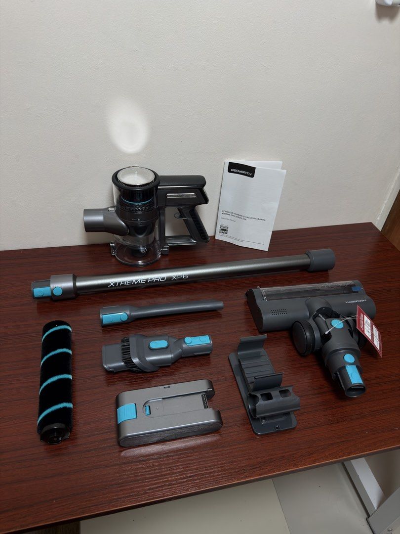 PerySmith Xtreme Pro XP6 Cordless Handheld Vacuum Cleaner (Category: Vacuum Cleaner & Housekeeping) located in Quezon City. Submitted by teejcoching (Listing ID 1466411339, Image 2). Description: - Brand: PerySmith Xtreme Pro XP6 Cordless Vacuum - Condition: Brand new, unopened box inside the original outer shipping carton - Included: All original attachments, roller brush, battery, charging wall mount, and manual - Performance: High-powered brus