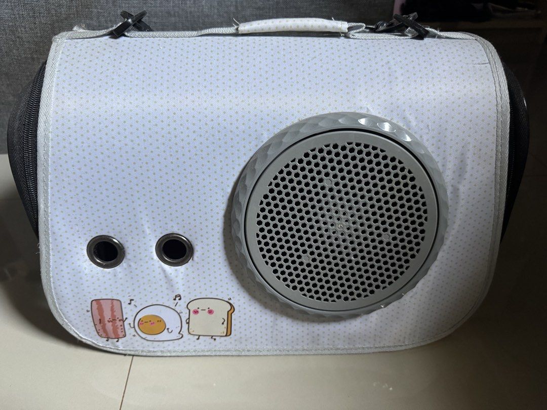 pet carrier bag (Category: Health & Grooming) located in Cagayan de Oro. Submitted by serenexsienna (Listing ID 1466528024, Image 1). Description: ✅Cute Cartoon Toast and Egg Pattern Pet Carrier Bag ✅Adorable breakfast (toast, bacon, and fried egg) graphics on light grey polka dot background ✅Large front mesh window and two eyelet holes for optimal airflow ✅Sturdy top handle with strap attachments for easy carrying ✅Secure zipper closure on the s
