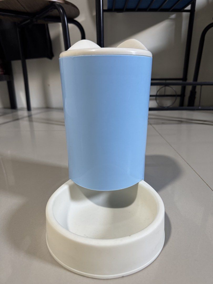 pet feeder (Category: Pet Food) located in Cagayan de Oro. Submitted by serenexsienna (Listing ID 1466527594, Image 1). Description: ✅Blue and White Gravity Pet Feeder ✅Color: Light blue and white ✅Type: Gravity pet feeder for cats and small dogs ✅Design: Large top storage cylinder with a wide feeding bowl ✅Maintenance: Easy to take apart and clean between refills ✅Condition: never been used ✅meet-up ✅delivery.