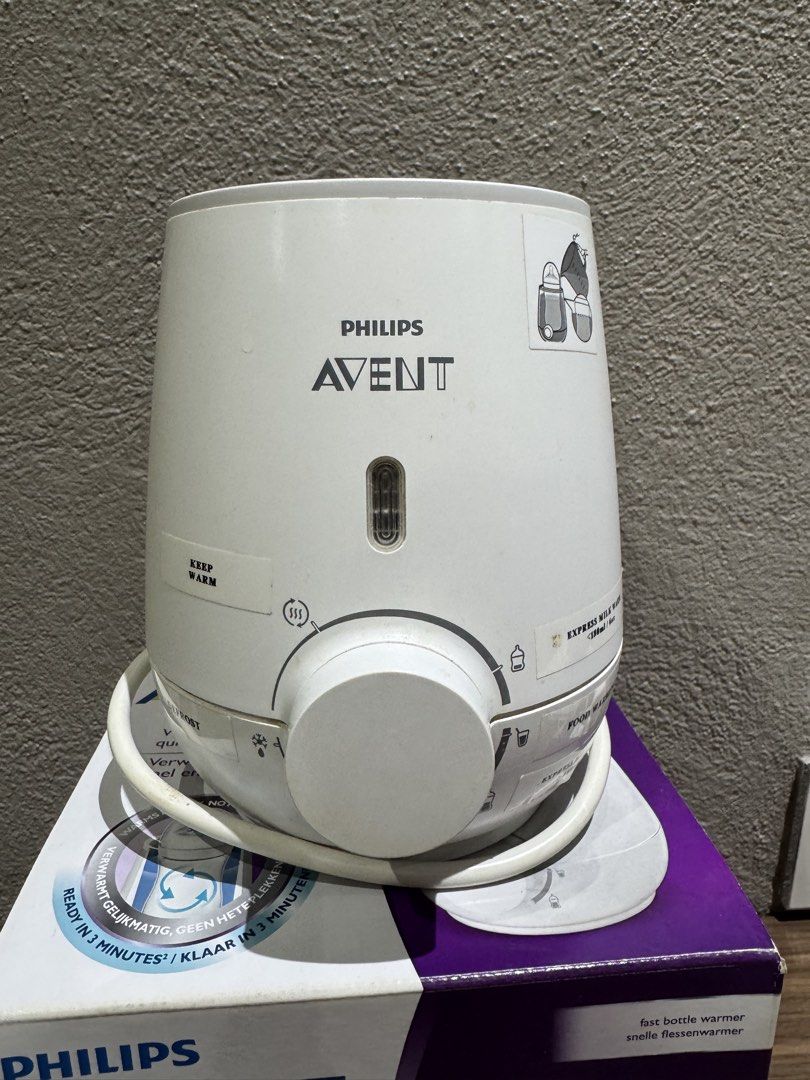 Philips Avent Fast Bottle Warmer with Original Box (Category: Breastfeeding & Bottle Feeding) located in Quezon City. Submitted by adilou (Listing ID 1466509662, Image 1). Description: - Warms milk quickly and evenly in just 3 minutes - Multiple settings: express milk warming, food warming, defrost, and keep warm - Easy-to-use dial control - Fully functional and comes with the original purple and white box.