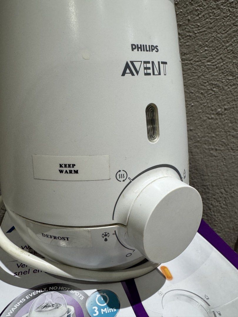 Philips Avent Fast Bottle Warmer with Original Box (Category: Breastfeeding & Bottle Feeding) located in Quezon City. Submitted by adilou (Listing ID 1466509662, Image 3). Description: - Warms milk quickly and evenly in just 3 minutes - Multiple settings: express milk warming, food warming, defrost, and keep warm - Easy-to-use dial control - Fully functional and comes with the original purple and white box.