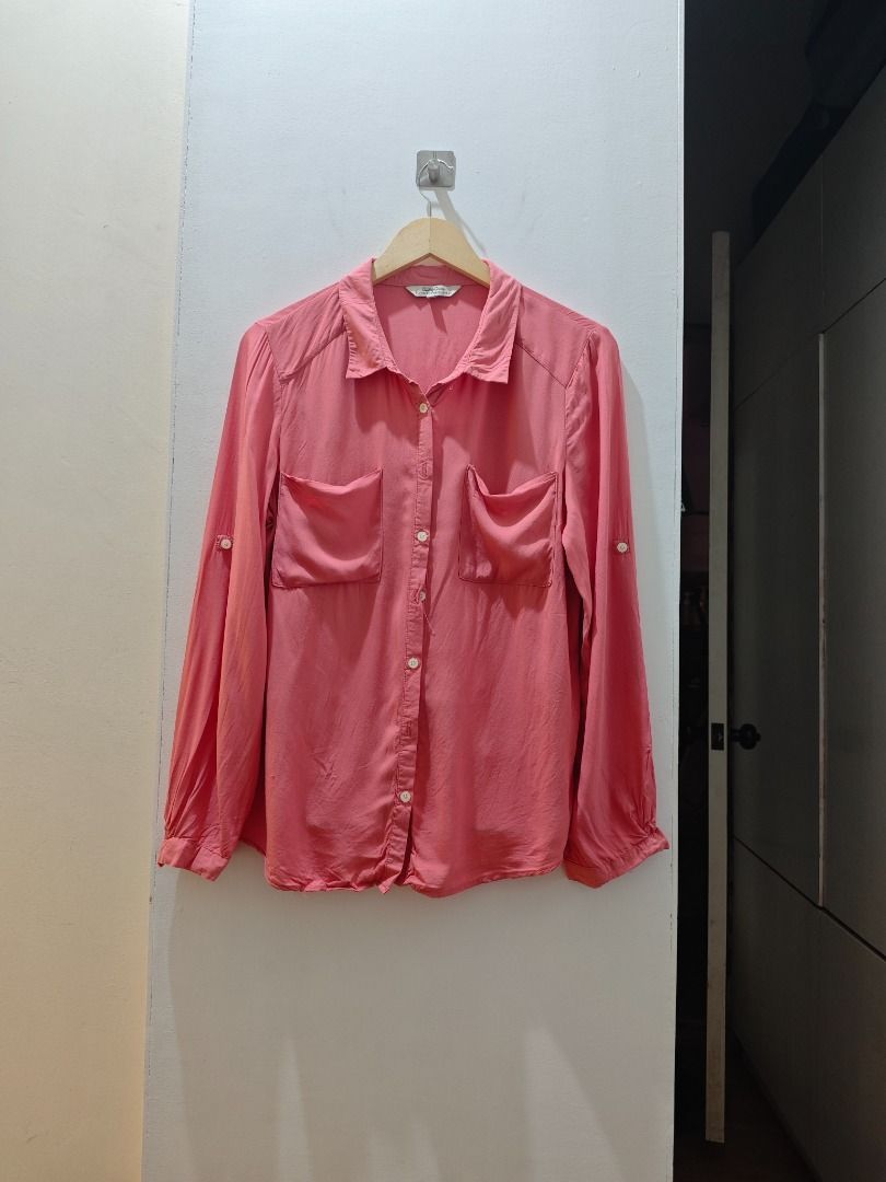 Pink Button-Down Long Sleeve Shirt not zara (Category: Longsleeves) located in Quezon City. Submitted by bushia.preloved (Listing ID 1466458396, Image 2). Description: - Color: Vibrant pink - Style: Long sleeves with roll-tab option, button-up front, and collared neckline - Details: Features convenient front chest pockets - Fabric: Lightweight and drapes nicely for all-day comfort Loc South Triangle, QC - Shipping via lalamove, grab or j&t Mode o