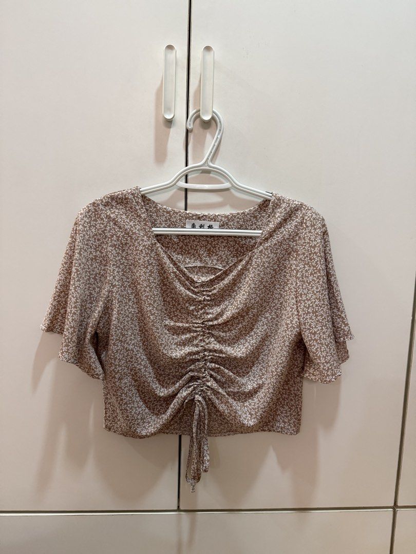 Pink floral printed ruched blouse (Category: Blouses) located in Quezon City. Submitted by hazpreloved (Listing ID 1466420648, Image 1). Description: Floral printed top with ruched design Bought in HK Free size, best fits Small Discounts for bulk orders Tags: shein, mango, pull & bear, h&m, cotton on.