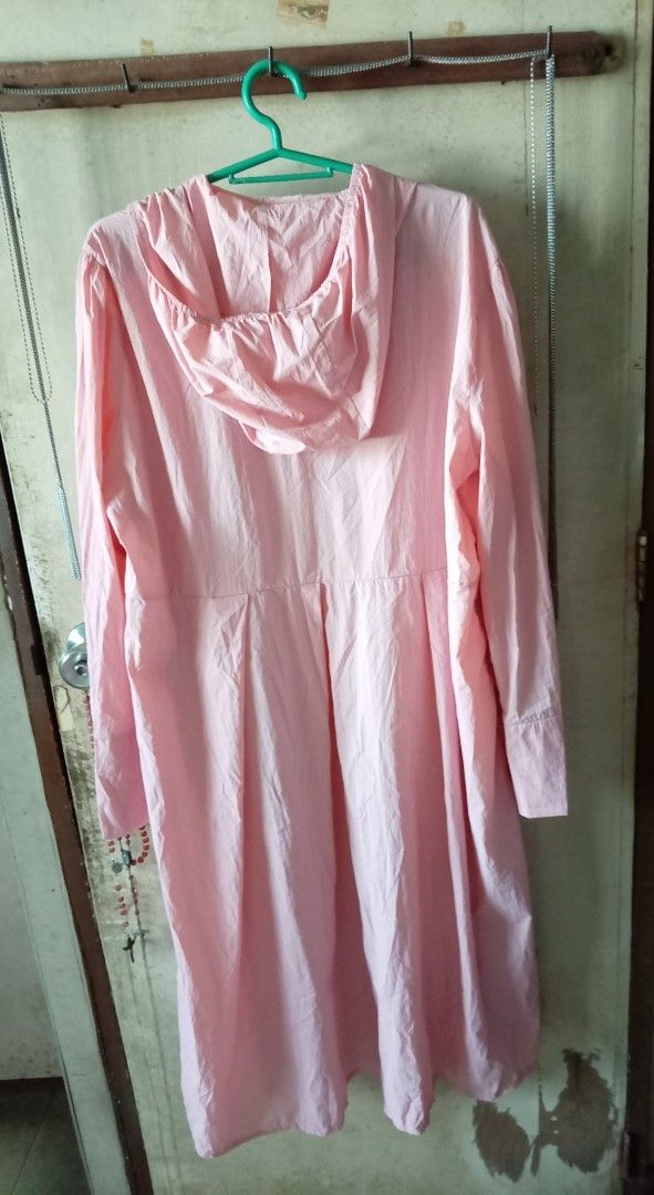 Pink Long Raincoat (Category: Coats, Jackets and Outerwear) located in Quezon City. Submitted by chacha30.s (Listing ID 1466345449, Image 3). Description: - Color: Pink - Size: 3XL - Style: Lightweight windbreaker with attached hood and pleated flare skirt - Features: Full front zip, elastic waist panel, and wide sleeve cuffs - Benefits: Blocks wind while maintaining a dressy silhouette, easy to fold and pack . Text me at 09277152134 . Buy na po 