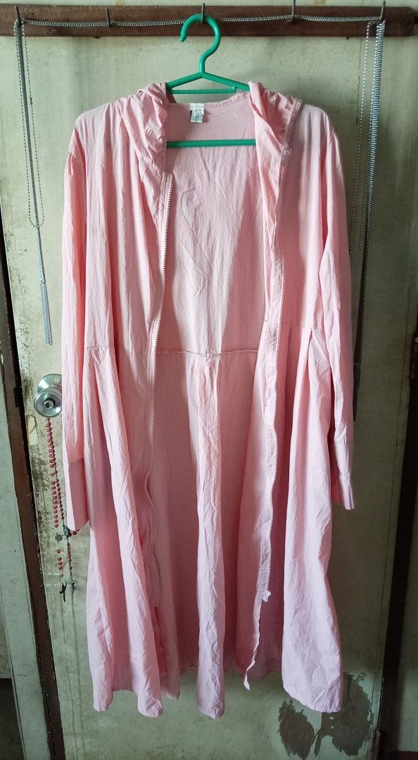 Pink Long Raincoat (Category: Coats, Jackets and Outerwear) located in Quezon City. Submitted by chacha30.s (Listing ID 1466345449, Image 1). Description: - Color: Pink - Size: 3XL - Style: Lightweight windbreaker with attached hood and pleated flare skirt - Features: Full front zip, elastic waist panel, and wide sleeve cuffs - Benefits: Blocks wind while maintaining a dressy silhouette, easy to fold and pack . Text me at 09277152134 . Buy na po 