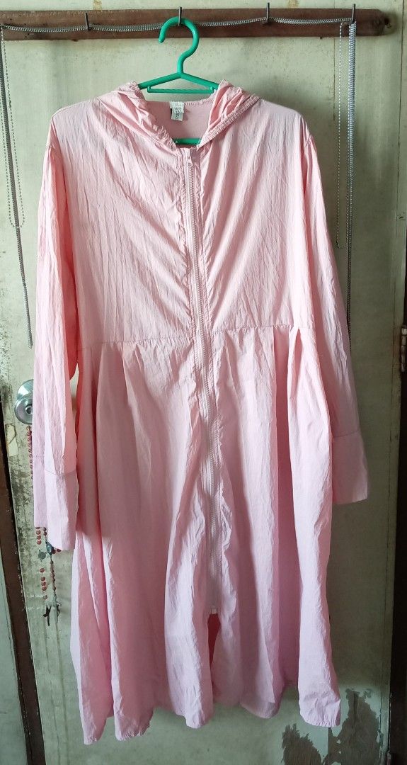 Pink Long Raincoat (Category: Coats, Jackets and Outerwear) located in Quezon City. Submitted by chacha30.s (Listing ID 1466345449, Image 2). Description: - Color: Pink - Size: 3XL - Style: Lightweight windbreaker with attached hood and pleated flare skirt - Features: Full front zip, elastic waist panel, and wide sleeve cuffs - Benefits: Blocks wind while maintaining a dressy silhouette, easy to fold and pack . Text me at 09277152134 . Buy na po 