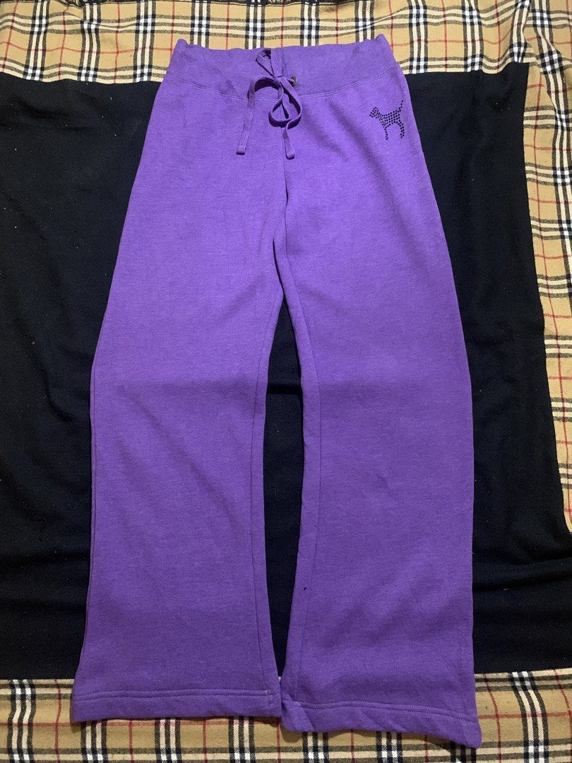 PINK nylon Purple Rhinestone Sweatpants (Category: Jeans) located in Cagayan de Oro. Submitted by chabermz (Listing ID 1466483114, Image 2). Description: - Brand: PINK nylon - Color: Purple - Size: Large - Design: Large rhinestone "PINK" lettering on the back waist and small rhinestone dog logo on the front left hip - Fit: Relaxed flare leg - Interior: Soft, cozy fleece lining - Waistband: Adjustable drawstring with metallic PINK" stamped grommet
