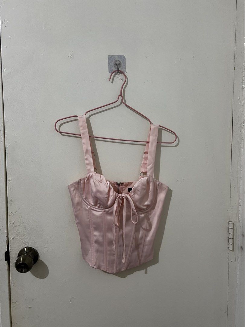Pink Satin Corset Top (Category: Sleeveless) located in Quezon City. Submitted by http.ashi (Listing ID 1466501595, Image 1). Description: - Color/Material: Pink silky satin - Features: Adjustable straps with silver hardware, tie-front accent, structured front boning, and shaped hemline - Closure: Full back zipper - Size 32-34A.