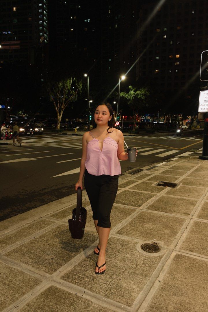 pink strap top (Category: Sleeveless) located in Pateros City. Submitted by jiannaross (Listing ID 1466477473, Image 3). Description: - Color: Light pink - Style: Spaghetti strap top with a plunging V-neck and connecting chest strap - Fit: Relaxed and loose - Fabric: Thin and lightweight - Perfect for: Casual night outs or warm weather, easily pairs with jeans or black pants.