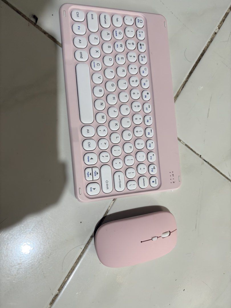 Pink Wireless Bluetooth Keyboard and Mouse Set (Category: Computer Keyboard) located in Manila. Submitted by gentlecloud_71412b (Listing ID 1466343044, Image 1). Description: - Matching pastel pink wireless keyboard and mouse combo for a dreamy desk aesthetic - Compact layout featuring cute round keycaps and contrasting white accent keys - Built-in slot stand at the top of the keyboard holds your tablet or phone securely - Smooth, pebble-shaped w