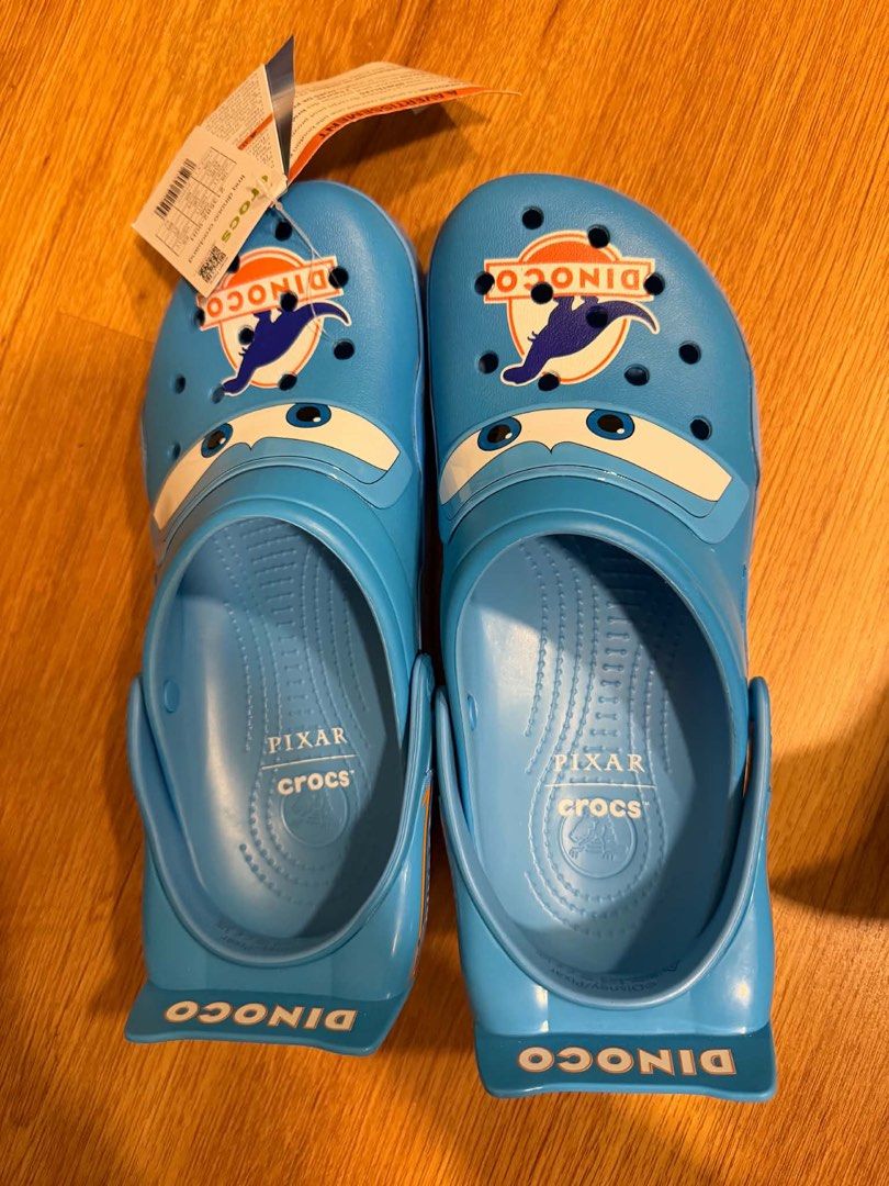 Pixar Crocs Dinoco Lightning McQueen Clogs (Category: Slippers & Slides) located in Quezon City. Submitted by jenkho (Listing ID 1466356340, Image 1). Description: - Brand new with original tags attached, never worn - Bright blue Pixar Dinoco Cars design - Features iconic eyes on the toe box - Dinoco logo on top and lettering on the heel strap - Super fun and collectible pair for any Disney/Cars fan - DM for size availability and shipping details