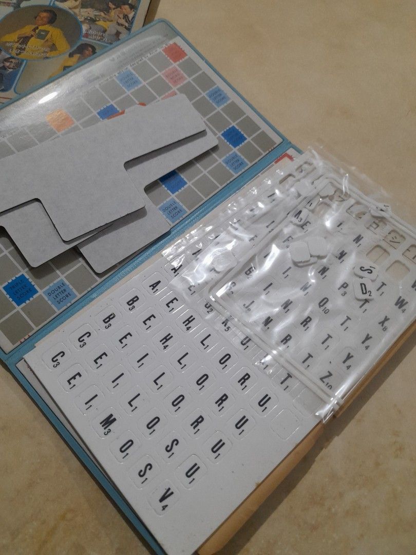 Pocket Edition Scrabble Crossword Game (Category: Board Games & Puzzles) located in Bocaue. Submitted by marajapansurplus (Listing ID 1466480636, Image 3). Description: - Vintage pocket edition Scrabble set - Includes folding board, letter racks, and original instruction booklet - Tiles are mostly unpunched on their original sheets - Compact design that folds neatly for travel - Outer box shows minor edge wear from storage, but all components are