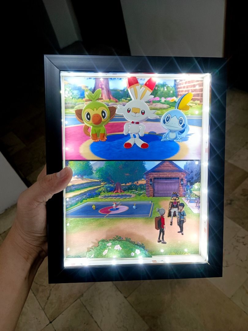Pokemon Sword/ Shield Video Game Shadow Box (Category: Nintendo) located in Quezon City. Submitted by natzuki10 (Listing ID 1466366308, Image 2). Description: Pokemon Sword/ Shield Video Game Shadow Box Height: 10 inches Width: 8 inches 750 w/o lights 920 w/ lights *Handmade Pixel Shadow Boxes *Accepting Customized Designs *Perfect for Gamers & Collectors #videogames #roomdecor #collection #gamer #gift #pokemon.