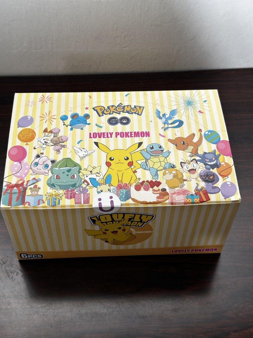 Pokémon Pokémon GO Collection Box English (Category: Card Boxes & Cases) located in Cavite. Submitted by debbieafrica (Listing ID 1466427814, Image 1). Description: Pokémon GO themed collection box features a festive design with various popular Pokémon like Pikachu, Bulbasaur, and Squirtle. The box is labeled as a 6-piece set and showcases a fun, celebratory aesthetic with balloons and gifts. It is a sealed, brand new item, ideal for collectors o