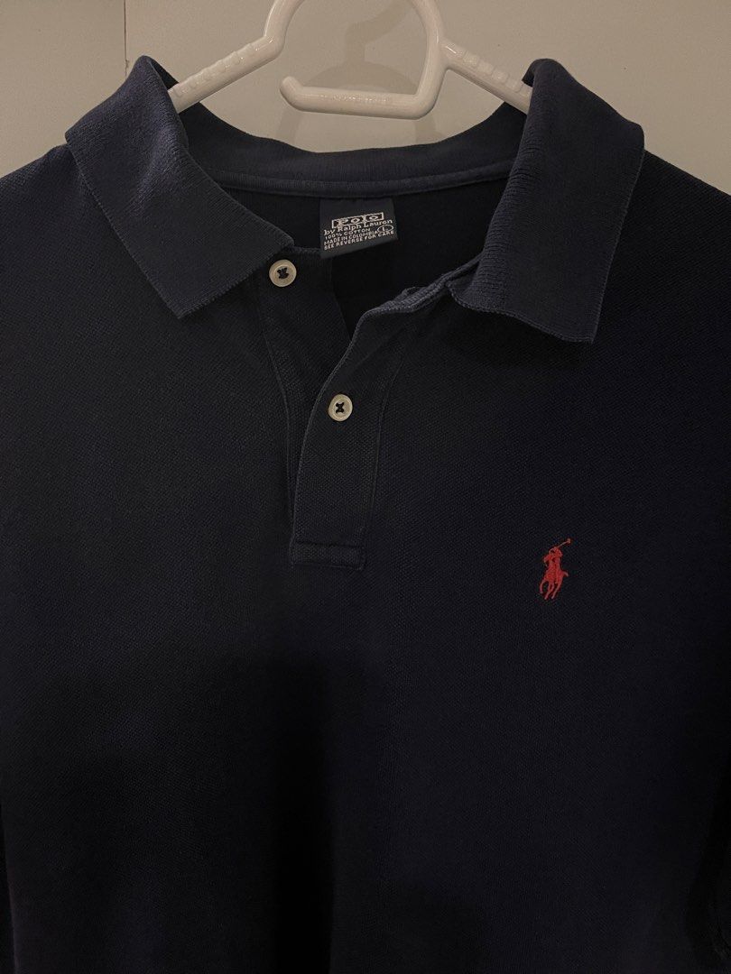 Polo by Ralph Lauren Navy Blue (Category: Tshirts & Polo Shirts ) located in Manila. Submitted by ig_i.00 (Listing ID 1466486117, Image 2). Description: - Vintage tag - Classic navy blue polo shirt with red embroidered pony logo - Large (21x 27) - Material: 100% cotton, made in Colombia - minimal stain at the back. check last slide.