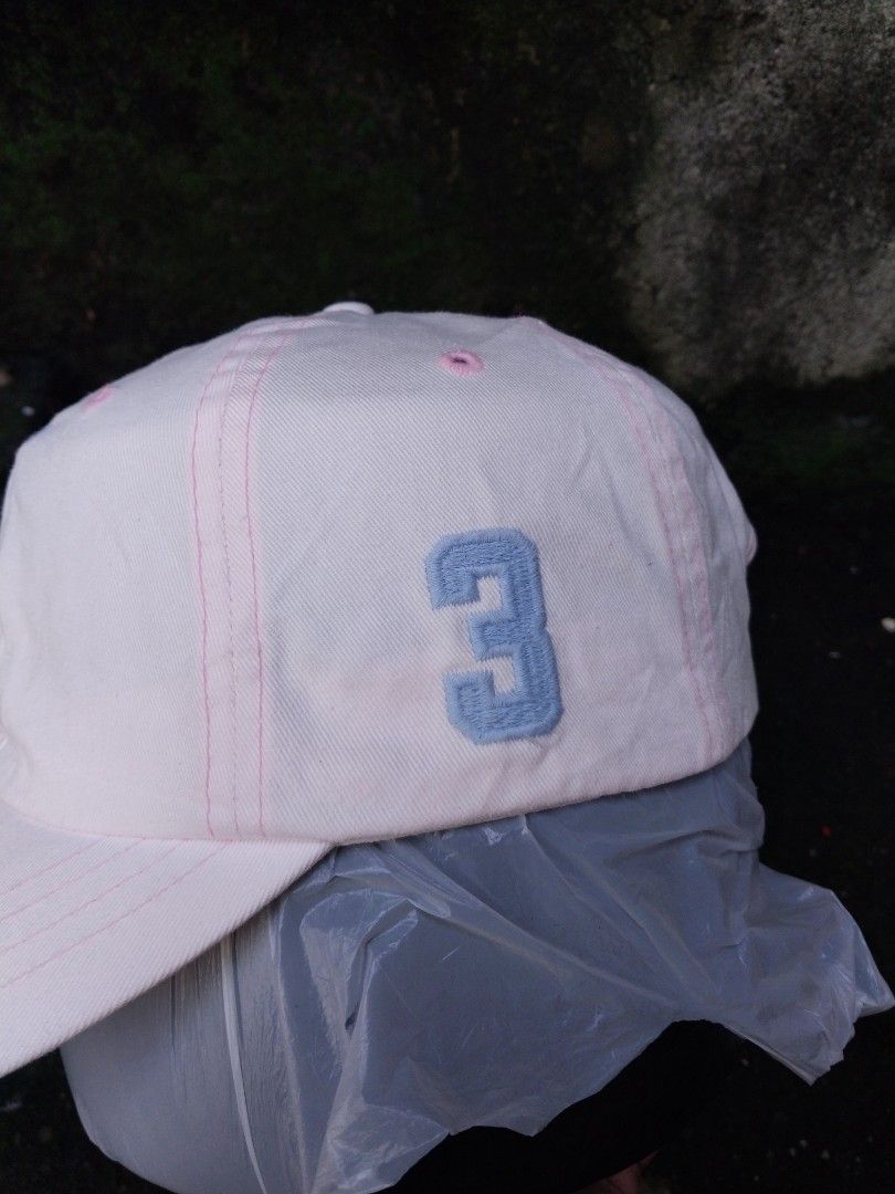 Polo by Ralph Lauren Pink Cap Hat (Category: Caps & Hats) located in Sorsogon. Submitted by Gthrift420 (Listing ID 1466450168, Image 2). Description: - Brand: Polo by Ralph Lauren - Color: Light pink with light blue embroidery and pink contrast stitching - Material: 100% cotton, Made in Taiwan - Design: Embroidered polo player on front, number three on side, and polo text on back - Fit: Adjustable brown leather strap with metal buckle - Condition
