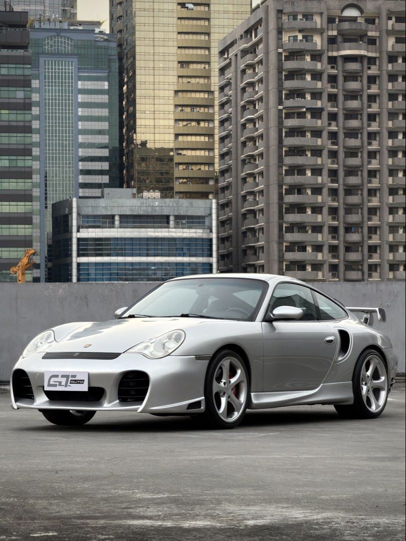 Porsche 911 Turbo 996 Auto (Category: Used Cars) located in Pasig City. Submitted by gtautoph (Listing ID 1466424500, Image 1). Description: ⬛️🟥🟨 FOR SALE 🟨🟥⬛️ 2001 Porsche 911 Turbo 996 TECHART 3.6L Twin-Turbocharged Flat-6 414 HP 560 Nm Torque 5-Speed Tiptronic S Automatic Transmission All-Wheel Drive Porsche Mezger Engine VarioCam Plus Porsche Stability Management (PSM) Arctic Silver Exterior Black Leather Interior 18” TECHART Formula 5-Sp