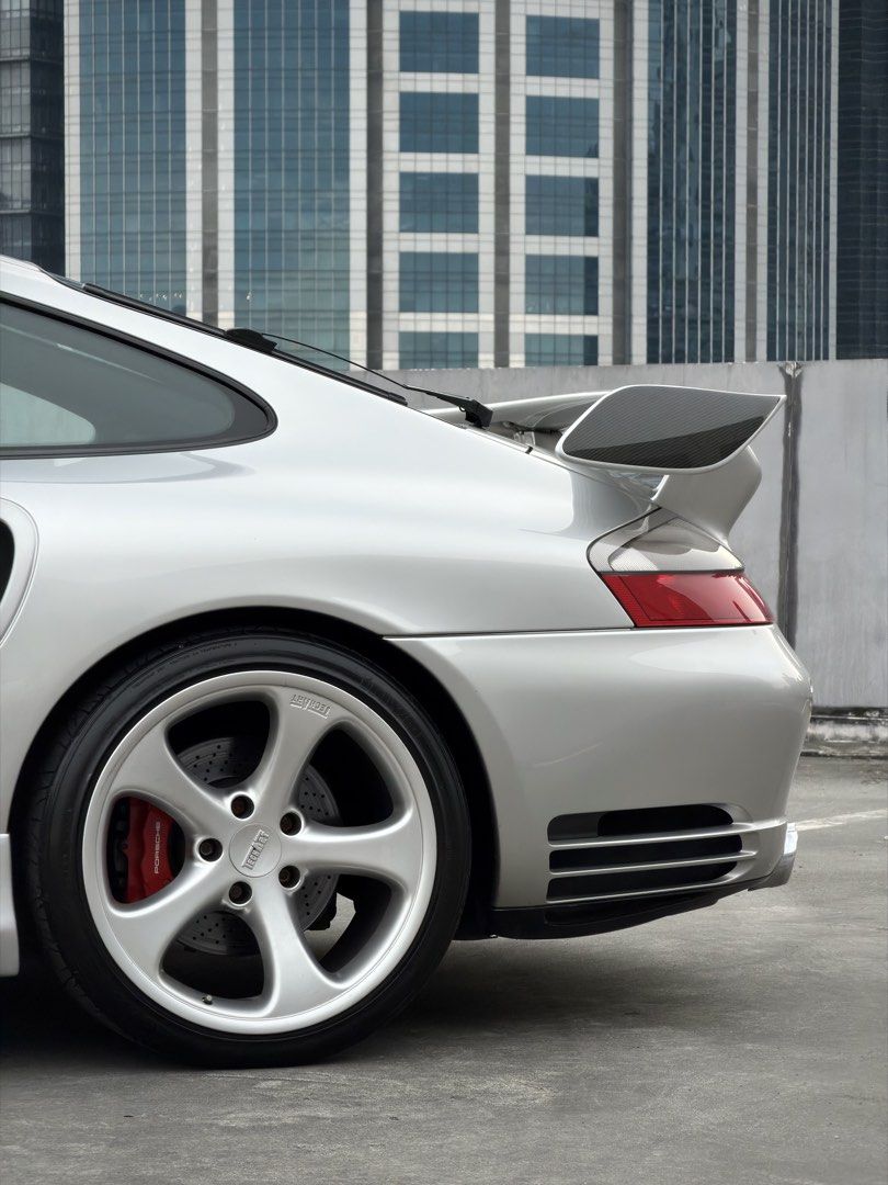 Porsche 911 Turbo 996 Auto (Category: Used Cars) located in Pasig City. Submitted by gtautoph (Listing ID 1466424500, Image 2). Description: ⬛️🟥🟨 FOR SALE 🟨🟥⬛️ 2001 Porsche 911 Turbo 996 TECHART 3.6L Twin-Turbocharged Flat-6 414 HP 560 Nm Torque 5-Speed Tiptronic S Automatic Transmission All-Wheel Drive Porsche Mezger Engine VarioCam Plus Porsche Stability Management (PSM) Arctic Silver Exterior Black Leather Interior 18” TECHART Formula 5-Sp