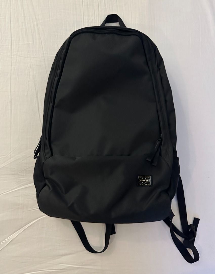Porter Tokyo Japan Black Backpack (Category: Backpacks) located in San Juan City. Submitted by looneyc (Listing ID 1466398153, Image 3). Description: - Authentic Porter Tokyo Japan backpack in classic black - Clean, minimalist design featuring a front zipper compartment - Signature woven Porter logo patch on the lower right - Sturdy build, perfect for daily commute or casual use - Adjustable shoulder straps equipped with convenient quick-release 