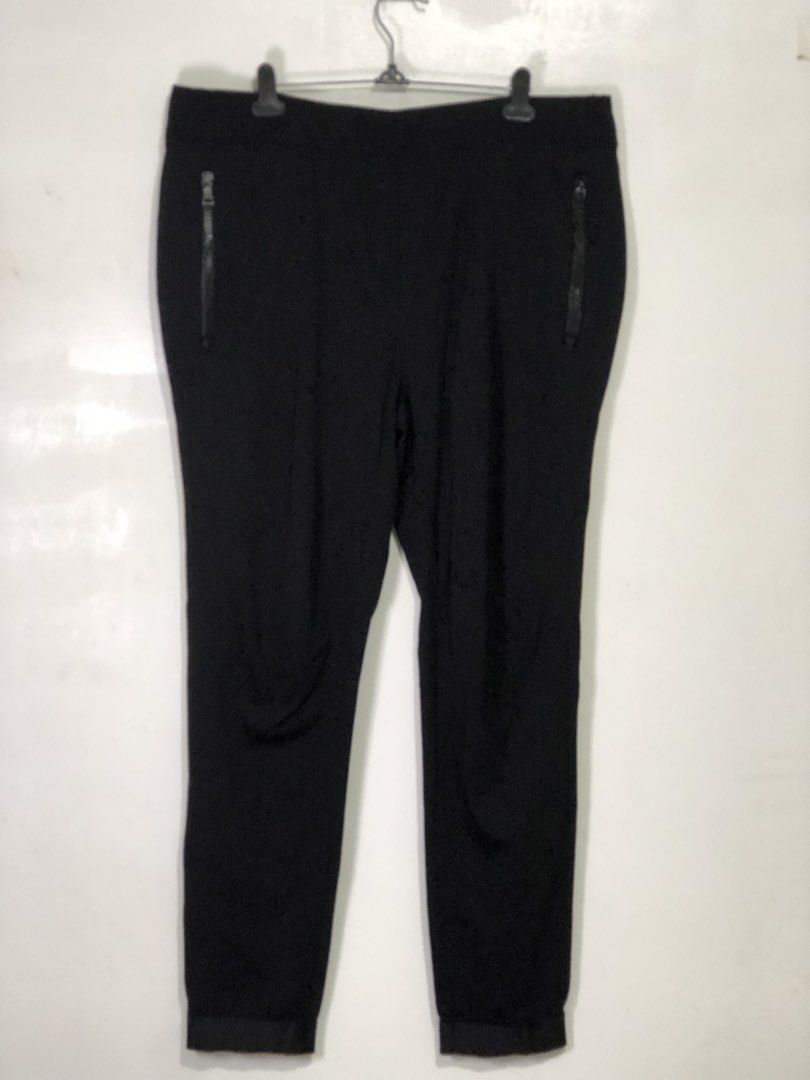 Prada Black Jogger Pants with Zipper Pockets (Category: Joggers) located in Quezon City. Submitted by clarizedeo09960 (Listing ID 1466498716, Image 1). Description: - Brand: Prada - Color: Solid black - Material: Thick athletic fabric with comfortable stretch - Pockets: Two front zip pockets featuring Prada Milano hardware, plus one back pocket - Details: Iconic Prada red rubber logo tag on the back - Cuffs: Ribbed at the ankles - Condition: Clea